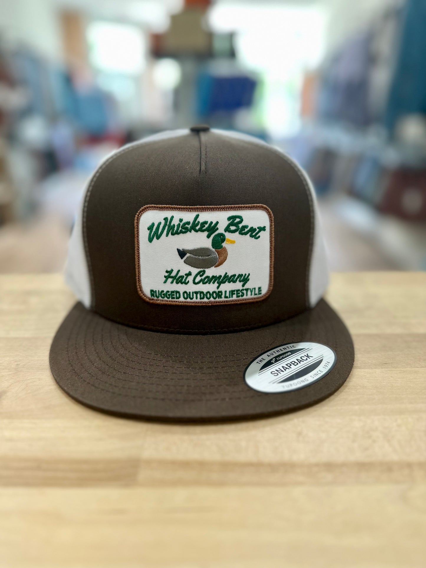 Whiskey Bent Hat Co.- Green Head 7-Panel Brown